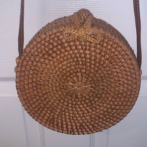 Lightly used straw round purse with shoulder strap